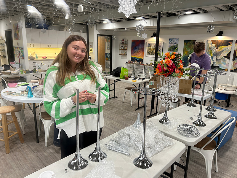 Student making centerpieces