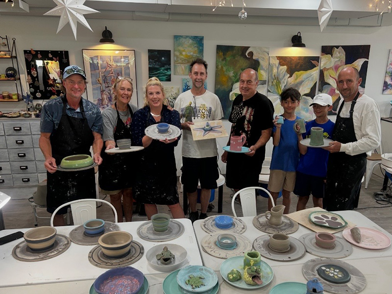 Students wih their clay projects